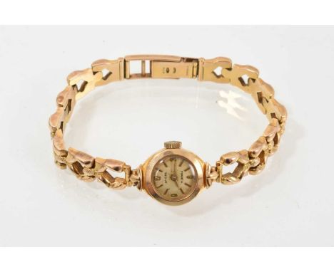 1960s Enicar 9ct gold ladies' wristwatch on integral 9ct gold fancy link braceletWeight 14.7 grams.