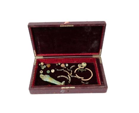 Collection of Egyptian antiquities, including Ushabti, beads and other jewellery, housed within a leather mounted box