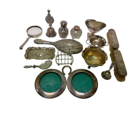 Selection of miscellaneous silver and white metal. including dressing table set, swing handled sugar vase, toast rack, magnif