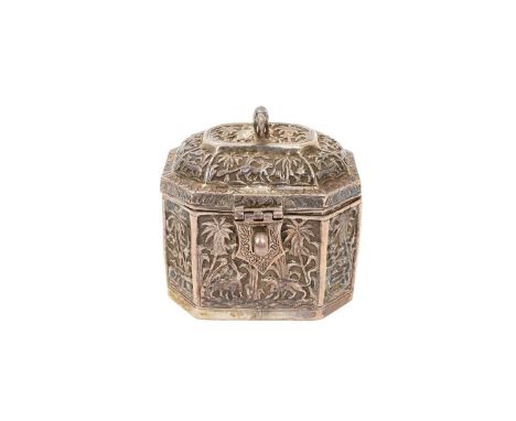 Late 19th/early 20th century Indian white metal tea caddy of hexagonal form, with embossed panels depicting jungle scenes and
