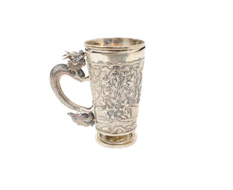 Late 19th early 20th century Chinese silver tankard of tapering form, with presentation inscription, embossed decoration of b
