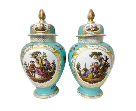 A large pair of late 19th century Dresden porcelain vases and covers, painted with figural scenes on a light blue ground with