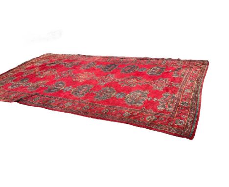 Large antique Turkish Ushak carpet with on red ground, 295cm x 530cm
