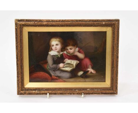 A 19th century continental porcelain plaque depicting two children reading a book, signed C.L. Vogel, in glazed gilt frame, a