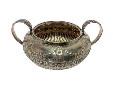 George IV silver twin handled sugar bowl of fluted form, with embossed decoration, on a circular base (London 1829) William B