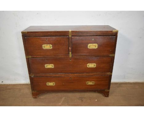Campaign style brass bound chest of drawers, of small size, having two short over two long drawers with flanking carrying han