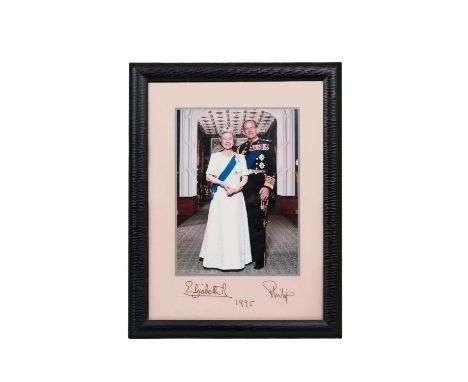 H.M. Queen Elizabeth II and H.R.H. The Duke of Edinburgh, fine signed presentation portrait photograph of the smiling Royal c