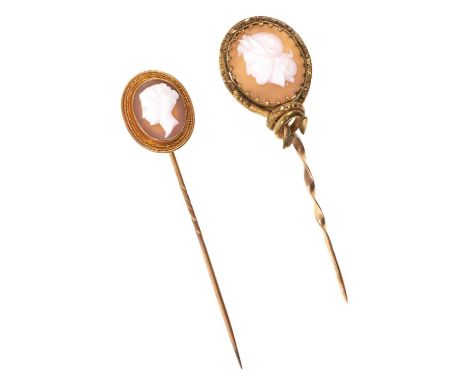 Two antique carved shell cameo stick pins, one depicting a classical bust, in gold mount, the other in gilt metal mount (2)