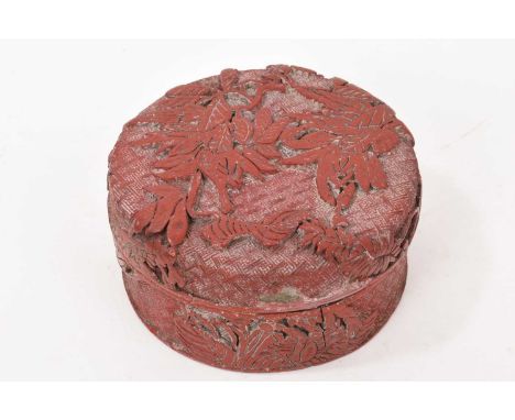 Antique cinnabar style box, of circular squat form, 15cm diameter, old collectors label to underside of lid
