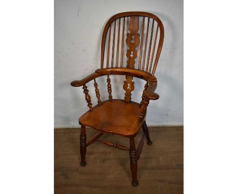 19th century ash and elm and fruitwood high back elbow chair, with saddle seat on ring turned splayed legs