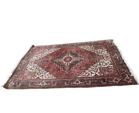 Heriz design carpet, centred by radiating medallion in main meander border, 295 x 202cm