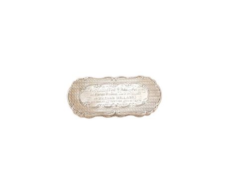 Victorian silver snuff box of shaped oval form, with engine turned decoration, hinged cover with engraved presentation inscri