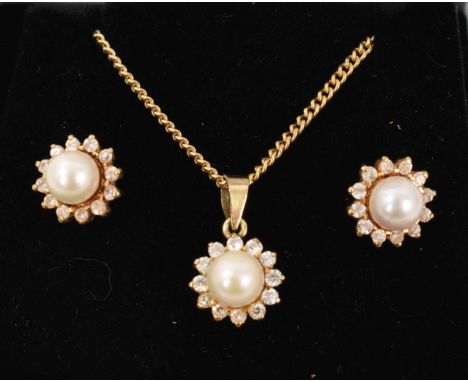 Cultured pearl and diamond cluster earrings and matching pendant, each with a 5.5mm diameter cultured pearl surrounded by a b