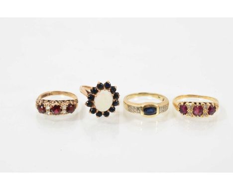Four 9ct gold and gem-set rings to include opal and sapphire cluster ring, sapphire and diamond ring, and two garnet rings (4