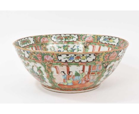 A 19th century Chinese Canton famille rose porcelain bowl, painted with panels of figures, birds and flowers, 34cm diameterIn