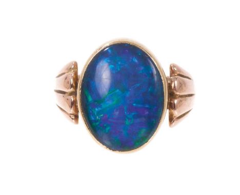 Antique black opal ring with an oval black opal cabochon measuring approximately 16mm x 12mm (possibly a doublet or triplet),