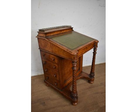 Mid 19th century figured walnut davenport with pierced brass gallery, stationery well, green leather inset writing slope, fou