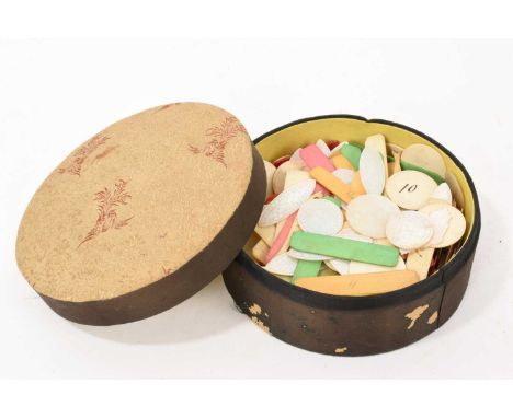 Large collection of 19th century gaming counters, in carved mother of pearl and bone, in excess of 150, housed in a silk dome