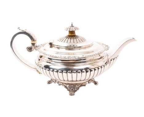 George IV silver teapot of compressed form, with fluted decoration, shell and gadrooned border, hinged cover and leaf mounted