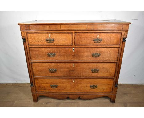 Regency oak chest of drawers with inlaid freeze, two short and three long graduated drawers with ivory/bone escutcheons, flan