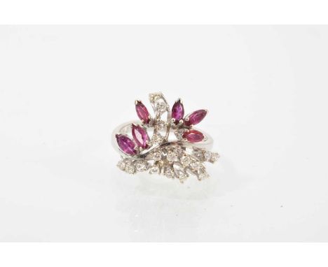 Diamond and ruby floral spray cocktail ring with six marquise cut ruby leaves and seventeen brilliant cut diamond stems, in 1