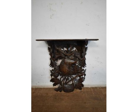 Late 19th / early 20th century Black Forest carved lindenwood wall bracket, with stag and hunting theme, 33cm wide x 41cm hig