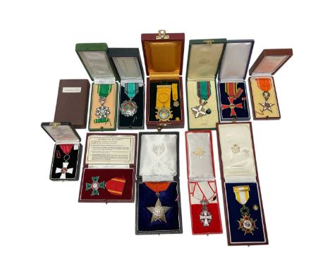 Collection of twelve foreign awards 1980s-1990s in boxes awarded to the Chief Clerk of the Master of The Royal Households Off