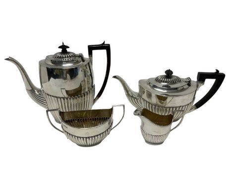 Composite late Victorian/early Edwardian silver three piece tea/coffee set, comprising teapot, with half fluted body, hinged 