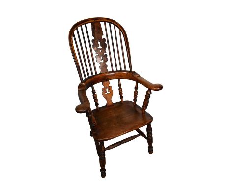 19th century elm and yew Windsor high back elbow chair, with pierced splat and saddle seat on turned splayed legs and H-stret