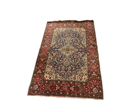 Kashan rug, with central radiating medallion on cream ground, in multiple flower head borders, 214 x 137cm