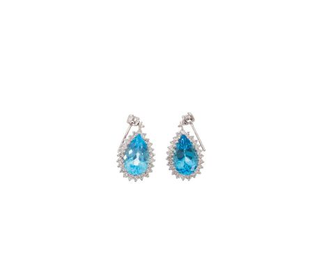 Pair of diamond and blue topaz pendant earrings, each with a pear-cut blue topaz surrounded by a border of brilliant cut diam