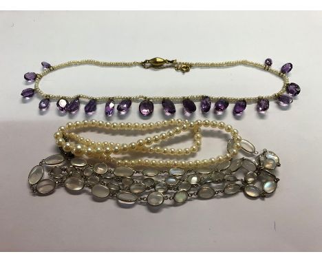 An Edwardian necklace, the single row of small seed pearls with twenty suspended graduated oval amethysts, knotted onto gold 