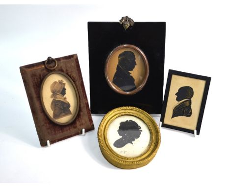 Four various Georgian silhouette cut-out miniature profile portraits - two ladies - one inscribed 'B Y Walker' - and two gent