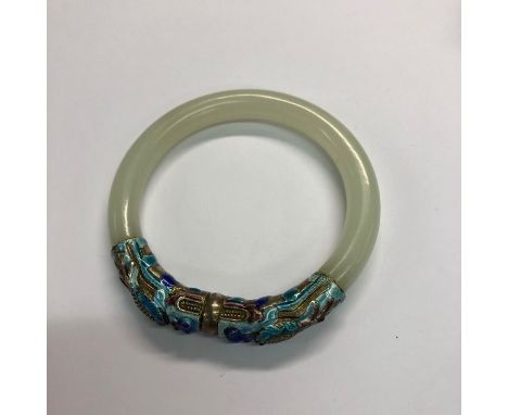 A Chinese jade bangle with applied enamel decoration, 8 cm diamGood condition, no damage