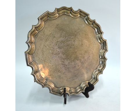 A large silver salver in the Georgian manner, with shaped and moulded rim, Walker &amp; Hall, Sheffield 1913, 44 oz, 37 cm di