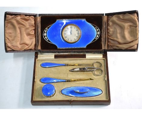 An Art Deco silver and blue basse-taille enamel strut-clock, Walker &amp; Hall, Birmingham 1927, in fitted easel-stand case, 