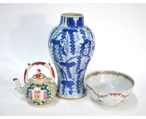 A Chinese blue and white baluster vase, decorated with floral designs, 23 cm high; together with a famille rose teapot; and a