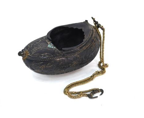 A Persian coco-de-mer Kashkul of typical form with hanging chain; decorated with cartouche of Naskh, or other text (the Naskh