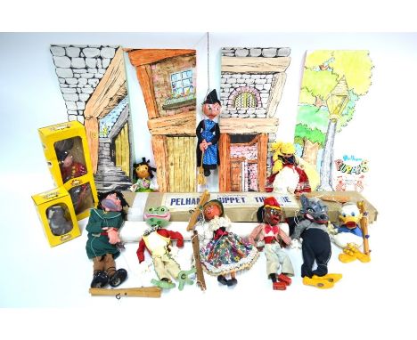 Two boxed Pelham Puppets, Bengo and Fritz, nine others - unboxed - including Donald Duck, and a Pelham Puppet Theatre with pr
