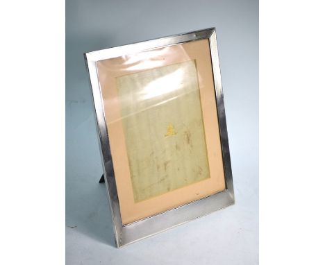 An engine-turned silver photograph frame, Elkington &amp; Co., London 1939, 30 x 23 cm overall; oak backed