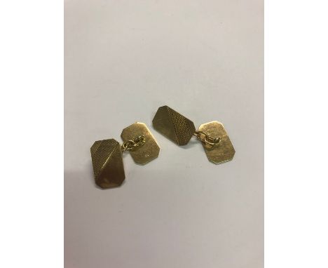 A pair of yellow metal rectangular cufflinks with engine turned decoration to/w a pair of oval cufflinks engraved with initia
