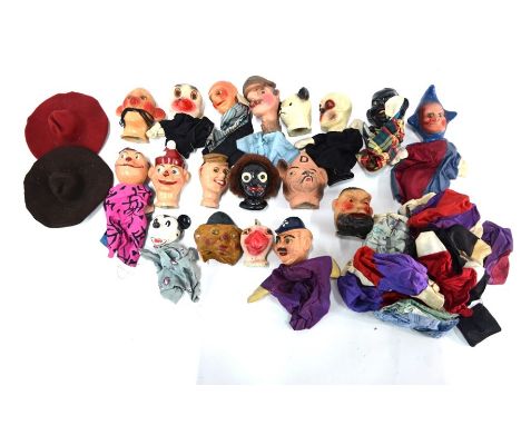 A collection of vintage composite puppet-heads with cloth bodies, some a/f