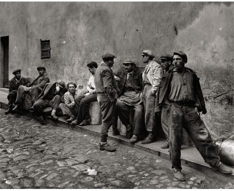 Güler, Ara -- "Carriers Waiting for Work at the Oil Quay, Istanbul ". 1954. Large-format gelatin silver print on strong paper