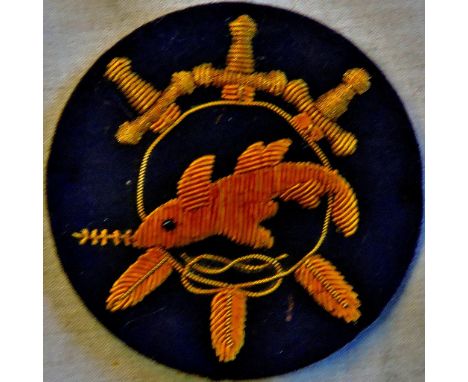 German Kriegsmarine cloth patch, made in gold bullion in black fabric in the design of a Shark surrounded with swords. See T&