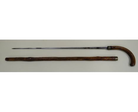 A WOODEN SWORDSTICK with brass ferrule engraved 'VHF', 91cms long