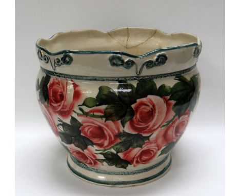 A LLANELLY PLANTER having a crimped rim, green lined and hand-painted with roses, 22cms diam (damaged and repaired)