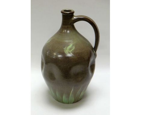 A WILLIAM FISHLEY HOLLAND STUDIO POTTERY FLASK with dimpled body, loop handle and in mottled grey and green glaze with sgraff