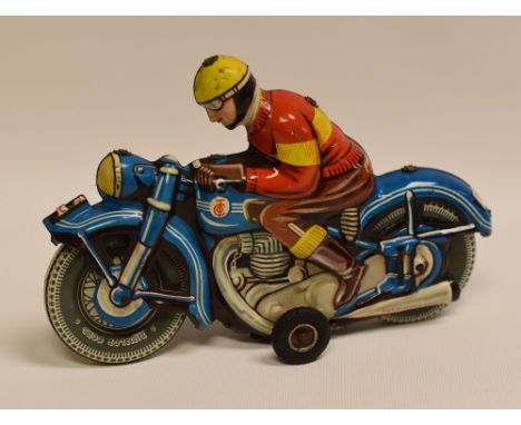 A TIPP & CO TINPLATE MOTORCYCLE WITH RIDER 'TCO-58', with internal clockwork motor, the motorbike in blue with 'Dunlop Cord' 