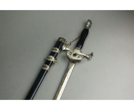 An American Masonic ceremonial sword with plated cross piece hilt and a figural head pommel, the straight 76cm length blade b