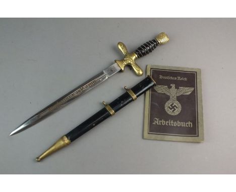 A Nazi Luftwaffe-style German dagger, with brass hilt, the blade marked 'Solingen, Puma', black wirebound hilt with eagle top